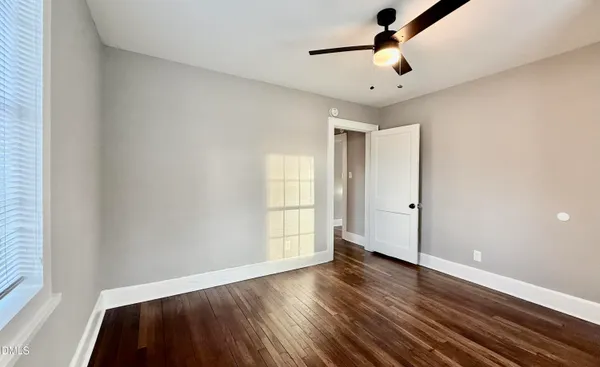 a view of a bathroom from a hallway