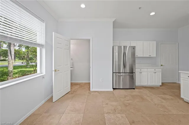 a view of a kitchen with refrigerator and yard