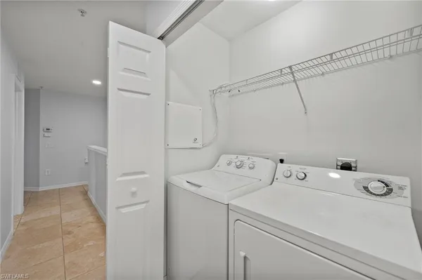 a view of a swimming pool with a lounge chair