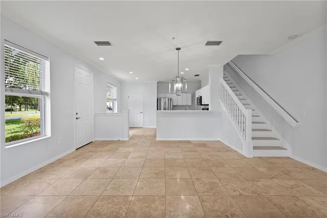 a view of entryway and hall with a window