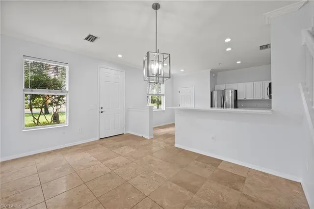 a view of a kitchen and window