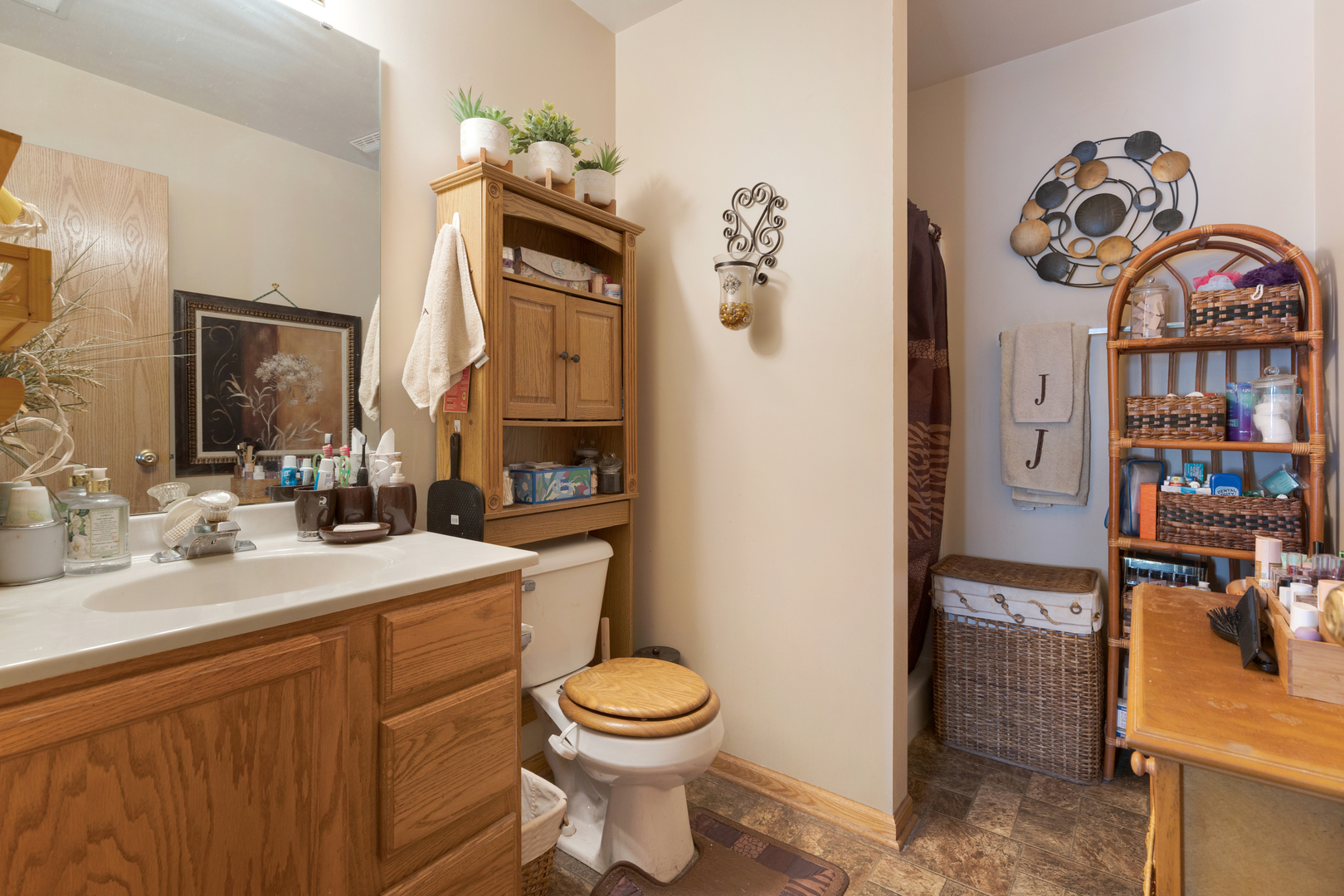 504 South Peace Road Sycamore, IL 60178 - Photo 12 of 20 a bathroom with a sink a toilet and a mirror