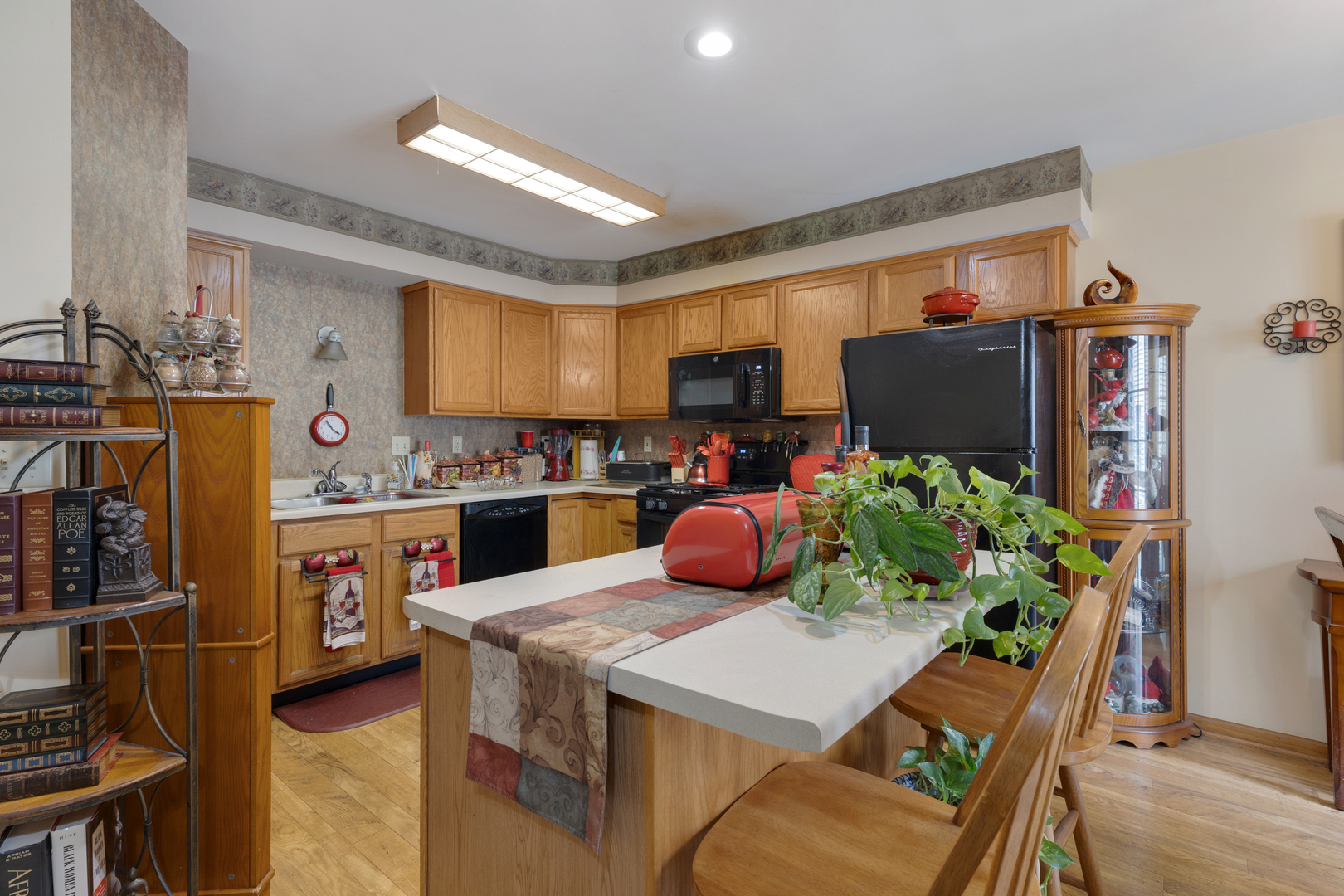 504 South Peace Road Sycamore, IL 60178 - Photo 6 of 20 a kitchen with a refrigerator and a dining table