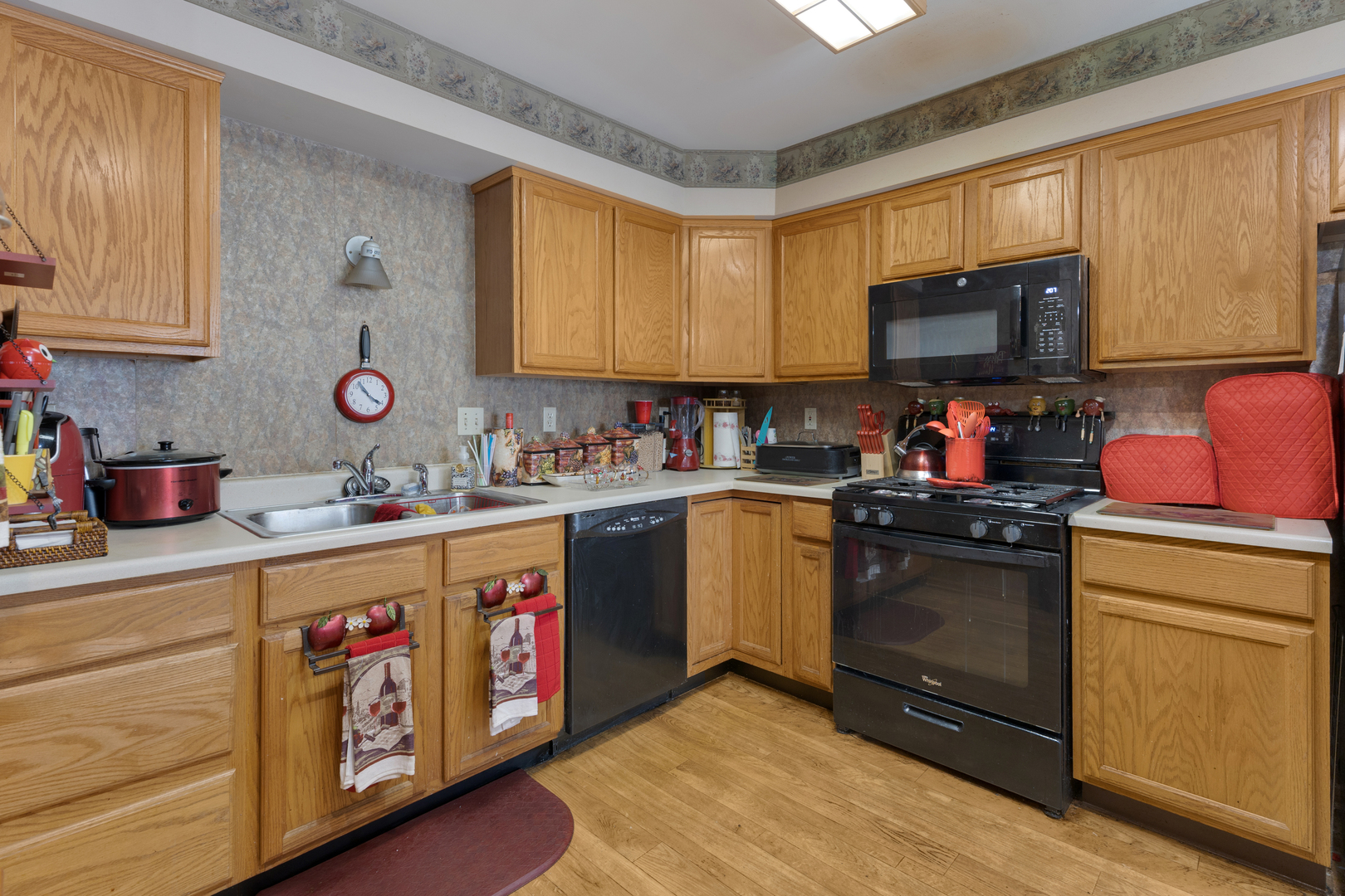 504 South Peace Road Sycamore, IL 60178 - Photo 7 of 20 a kitchen with granite countertop a sink cabinets and stainless steel appliances