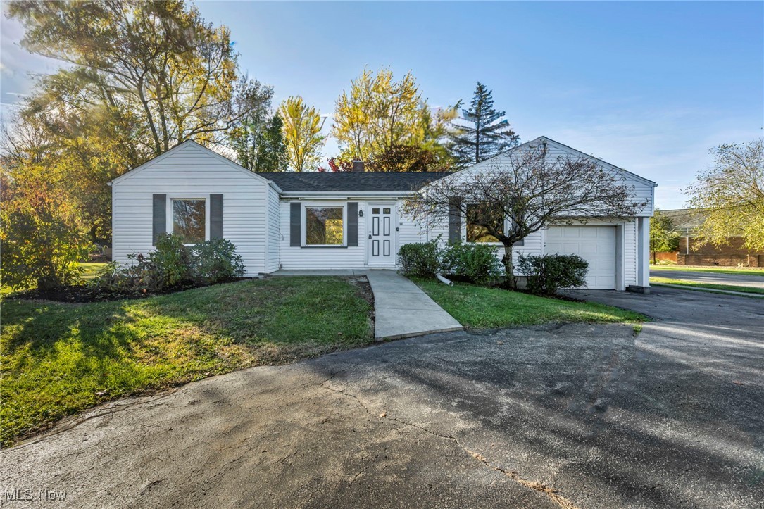 503 Churchill Road Youngstown, OH 44505 - Photo 25 of 32 Single story home featuring a front lawn, asphalt driveway, a garage, and a chimney