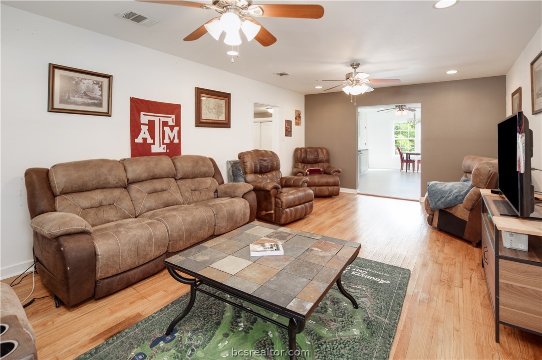 1204 East 28th Street Bryan, TX 77803 - Photo 7 of 22 a living room with furniture and a flat screen tv