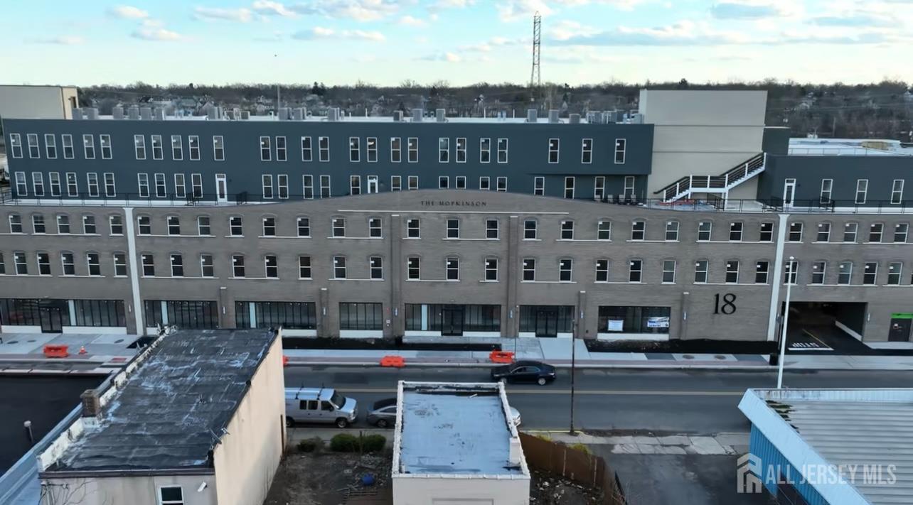 18 West Main Street, Unit 320 Bound Brook, NJ 08805 - Photo 20 of 28 a large building with a view of a lake