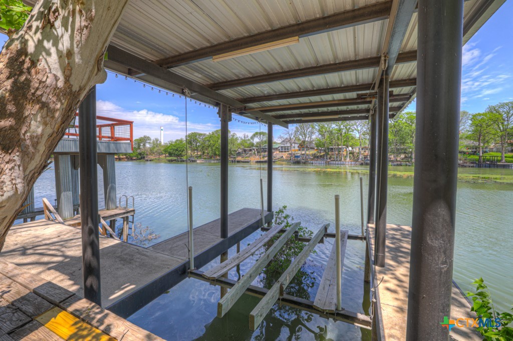 1015 Reiley Road Seguin, TX 78155 - Photo 27 of 45 a view of a balcony with chair and wooden floor