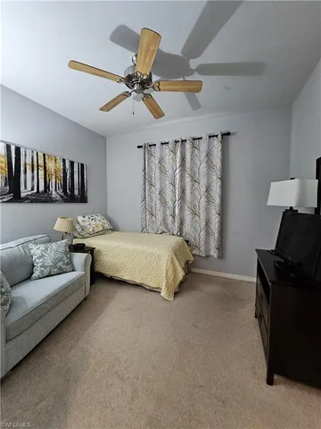 a spacious bedroom with a bed and furniture