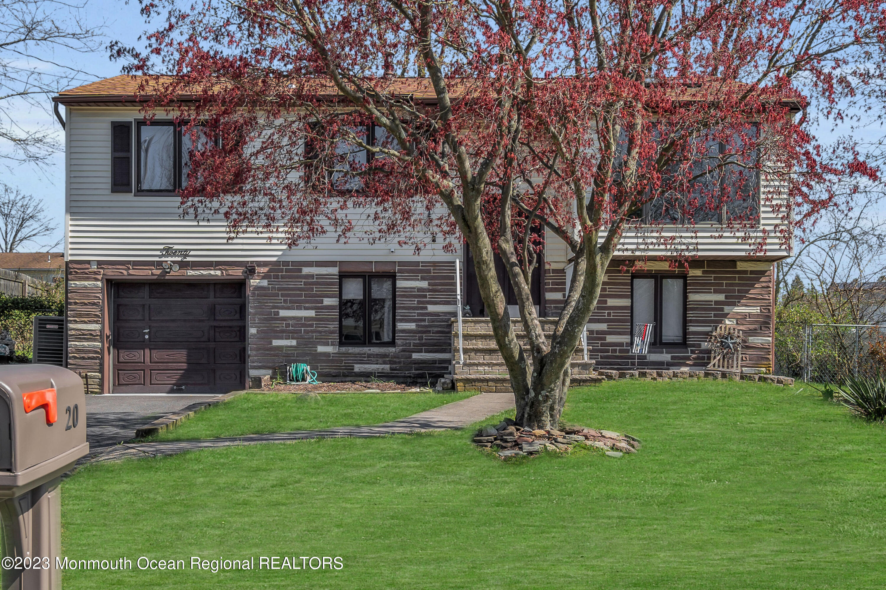20 Woodlark Road Toms River, NJ 08755 - Photo 1 of 32 a front view of a house with garden