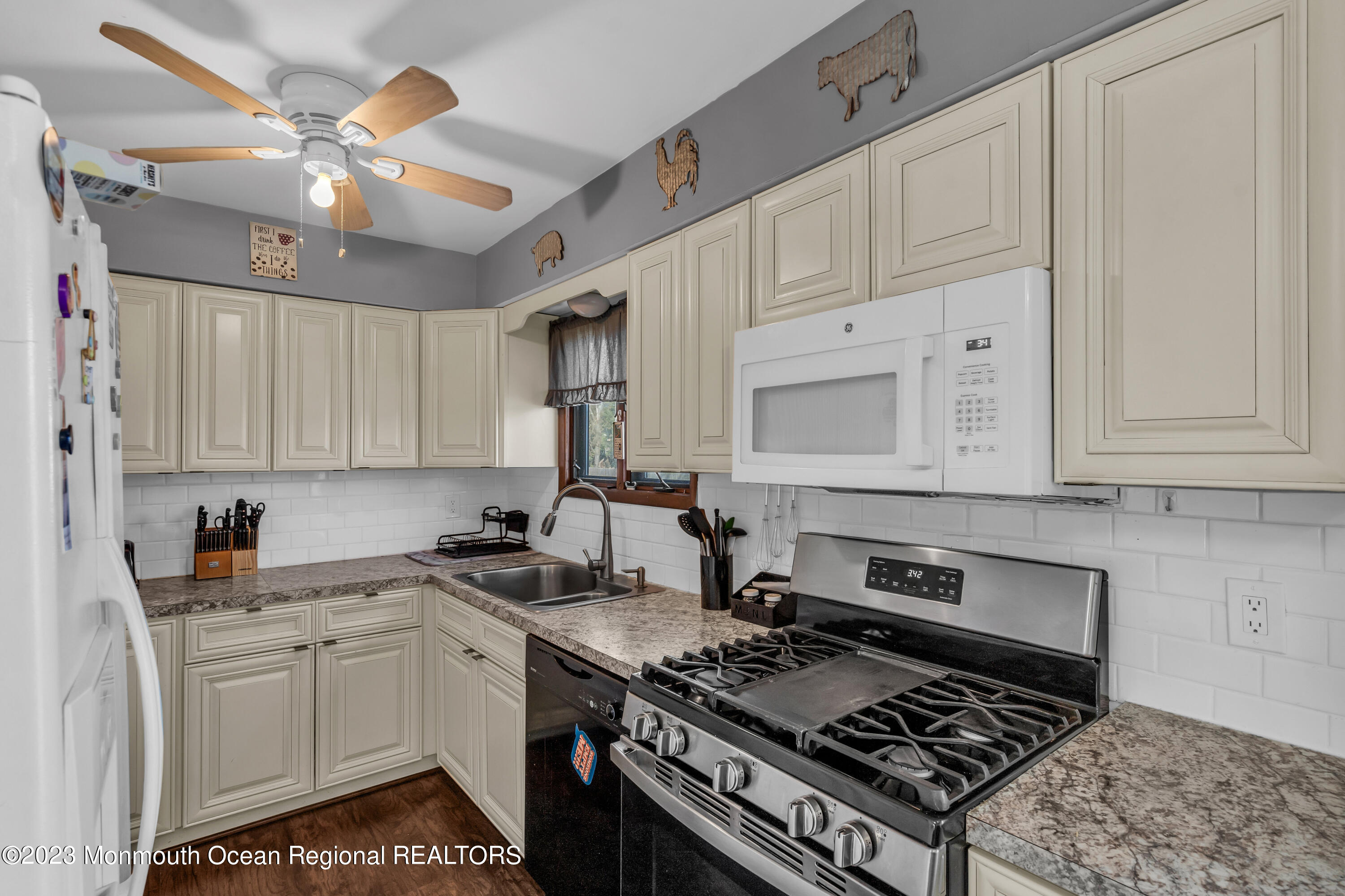 20 Woodlark Road Toms River, NJ 08755 - Photo 11 of 32 a kitchen with stainless steel appliances granite countertop a sink stove and cabinets