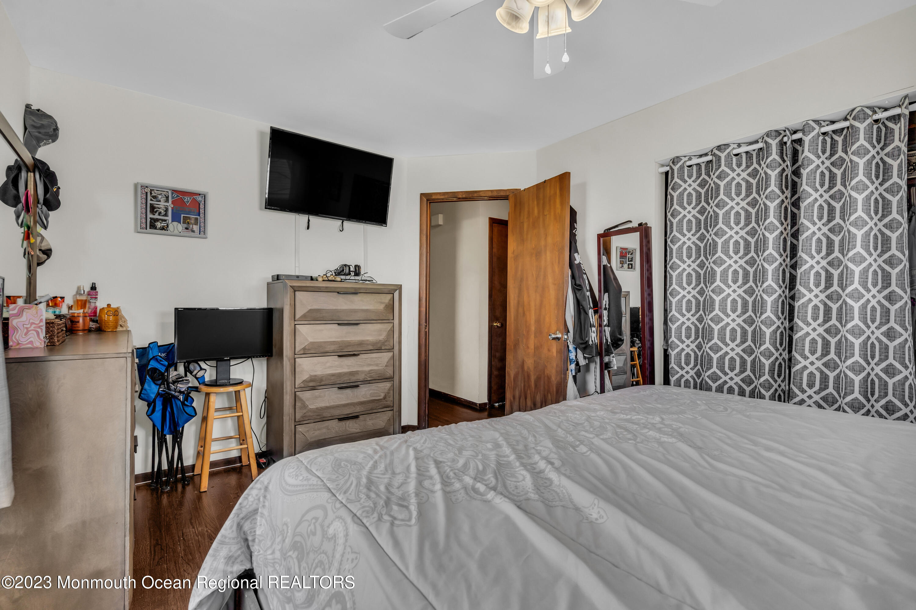 20 Woodlark Road Toms River, NJ 08755 - Photo 13 of 32 a bedroom with a bed and a flat tv screen on wall