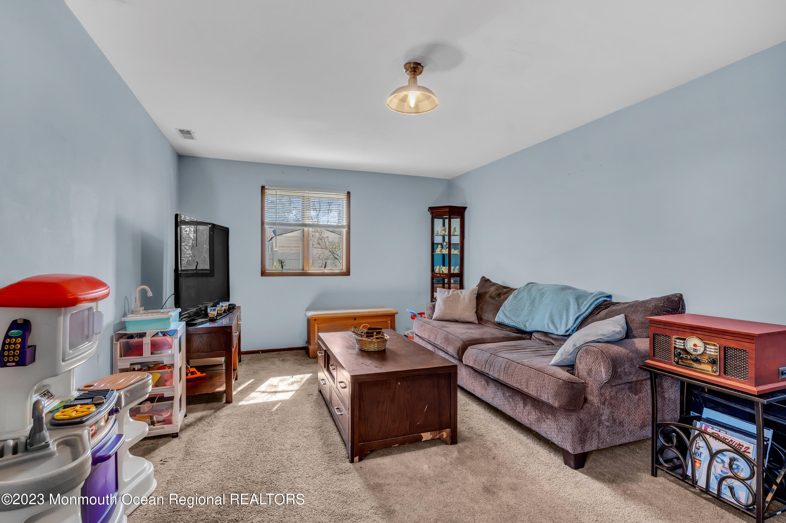 20 Woodlark Road Toms River, NJ 08755 - Photo 19 of 32 a living room with furniture and a flat screen tv