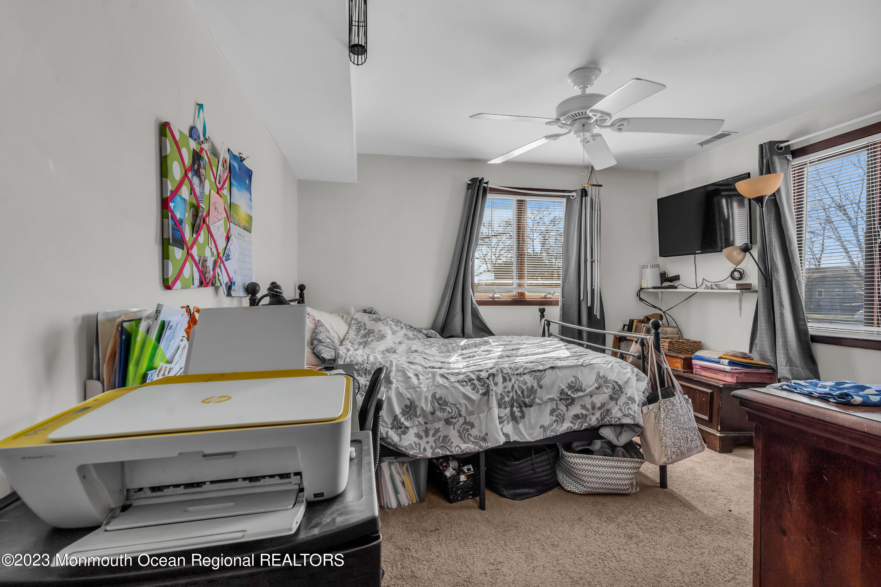 20 Woodlark Road Toms River, NJ 08755 - Photo 21 of 32 a living room with furniture and a flat screen tv