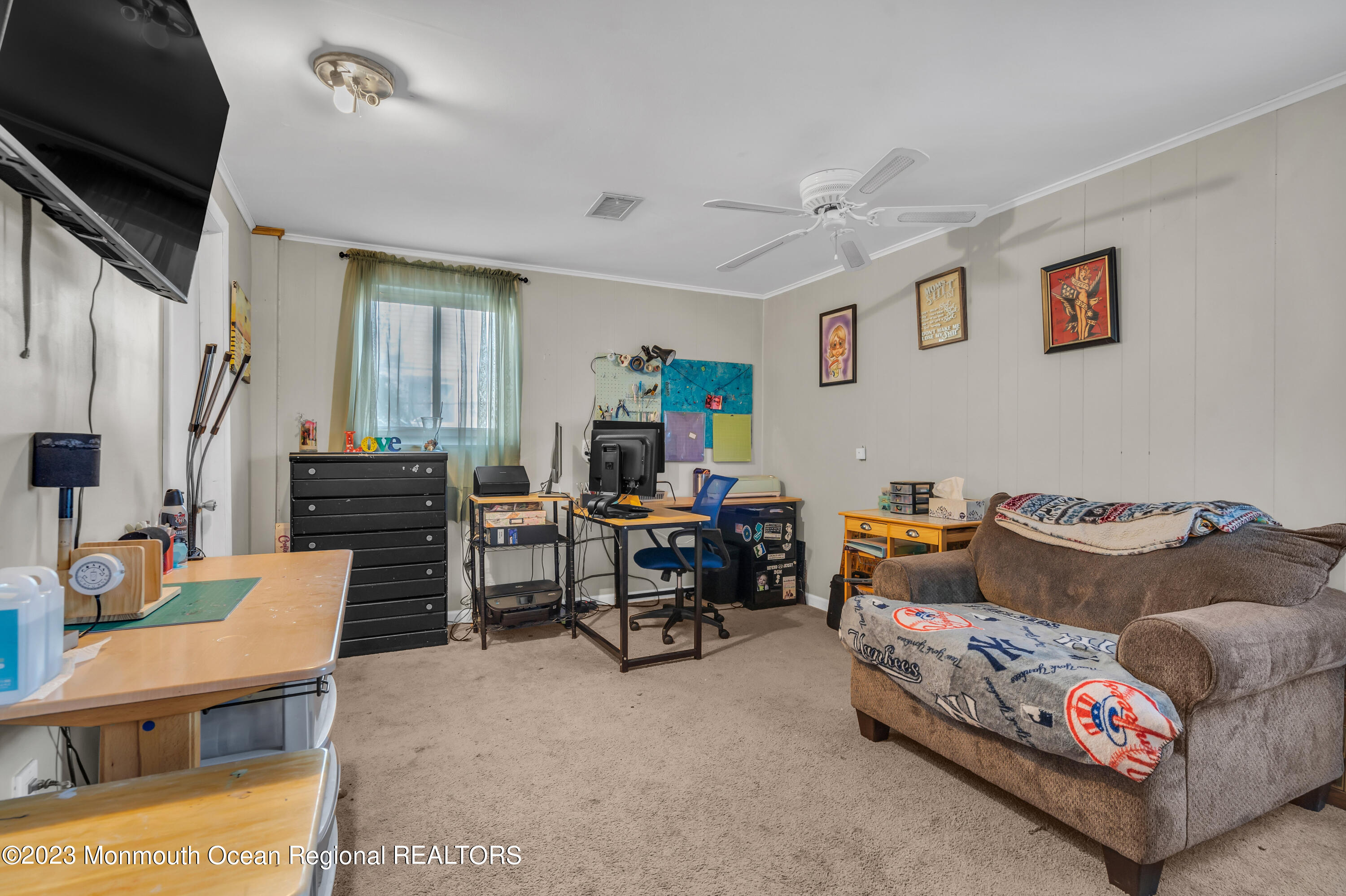 20 Woodlark Road Toms River, NJ 08755 - Photo 24 of 32 a living room with furniture and a flat screen tv