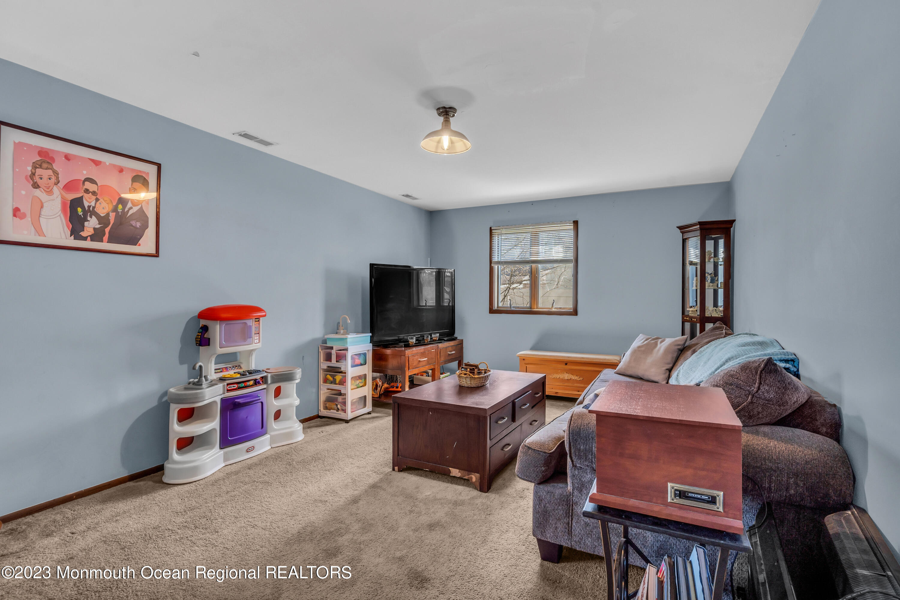 20 Woodlark Road Toms River, NJ 08755 - Photo 4 of 32 a living room with furniture and a flat screen tv