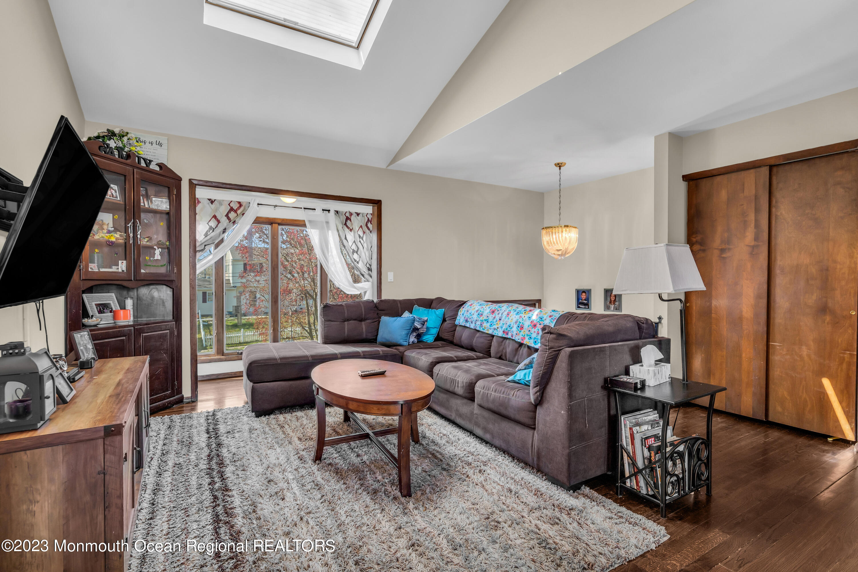 20 Woodlark Road Toms River, NJ 08755 - Photo 7 of 32 a living room with furniture a large window and a flat screen tv