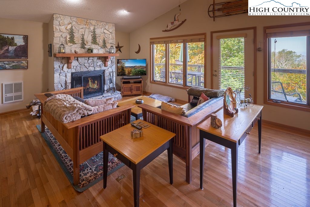 a living room with furniture a window and a fireplace