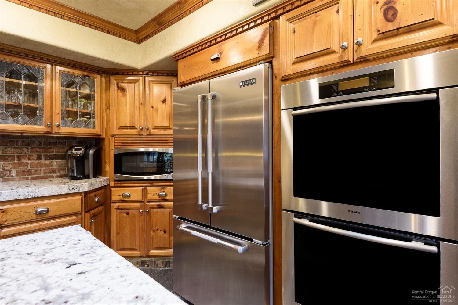 20190 Glen Vista Road Bend, OR 97703 - Photo 6 of 25 Knotty pine cabinets, brick back splash,