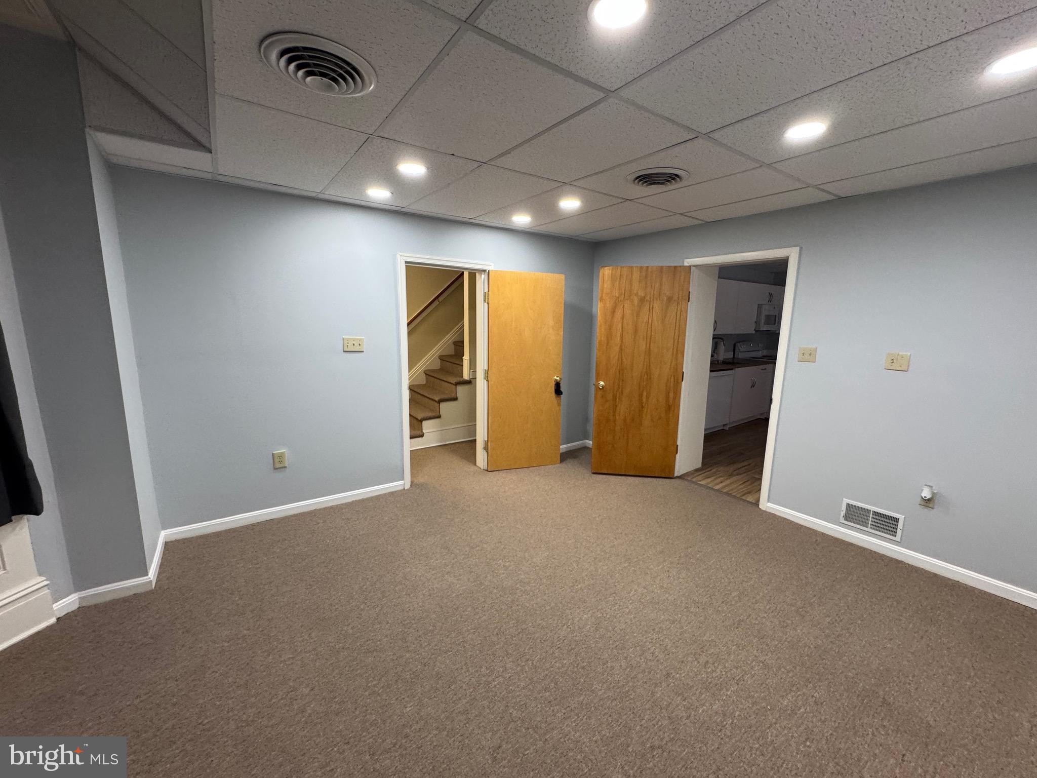 203 West John Street, Unit 4 Martinsburg, WV 25401 - Photo 14 of 17 an empty room with closet and natural light