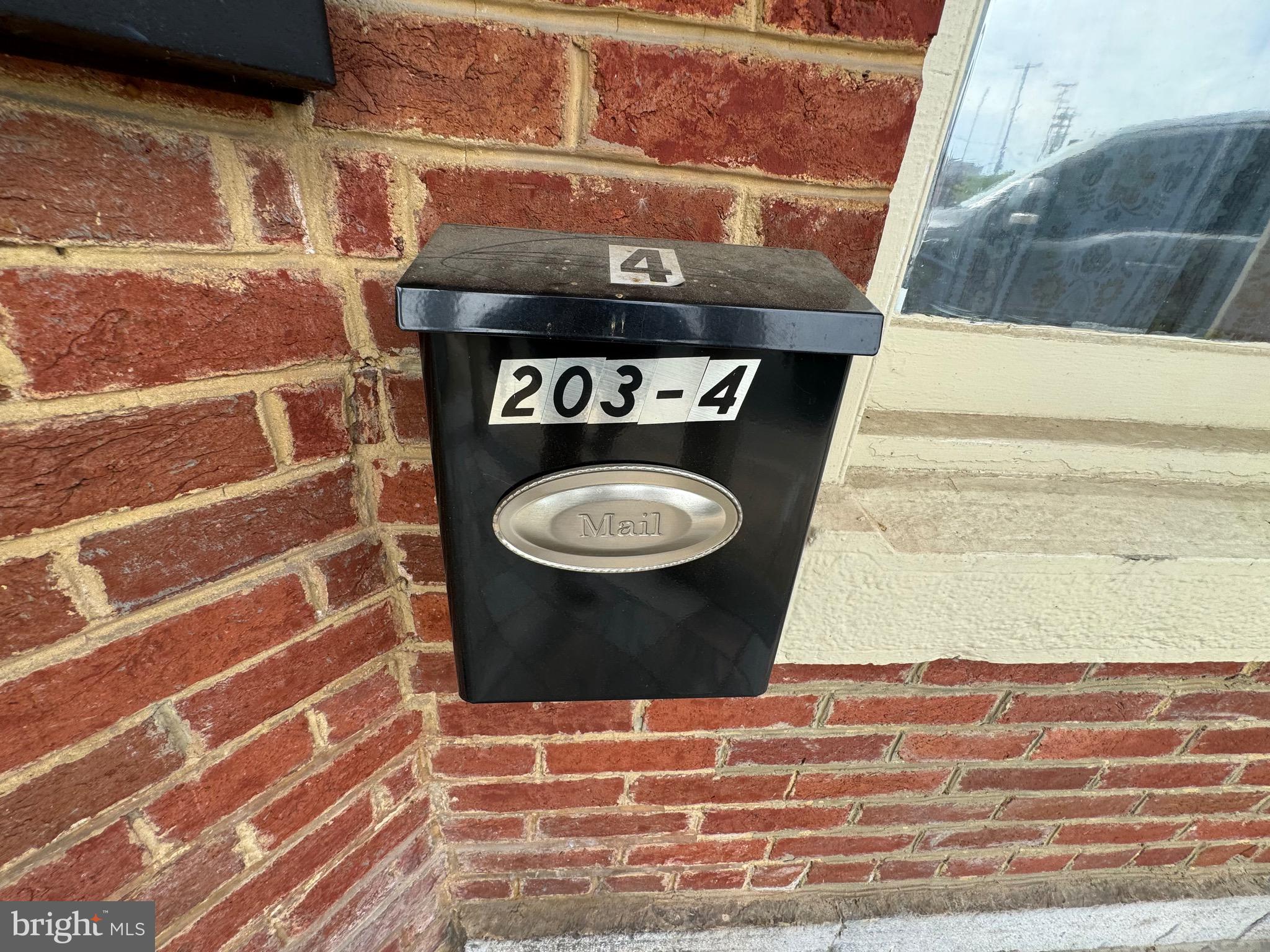 203 West John Street, Unit 4 Martinsburg, WV 25401 - Photo 4 of 17 a bathroom with a toilet and a shower