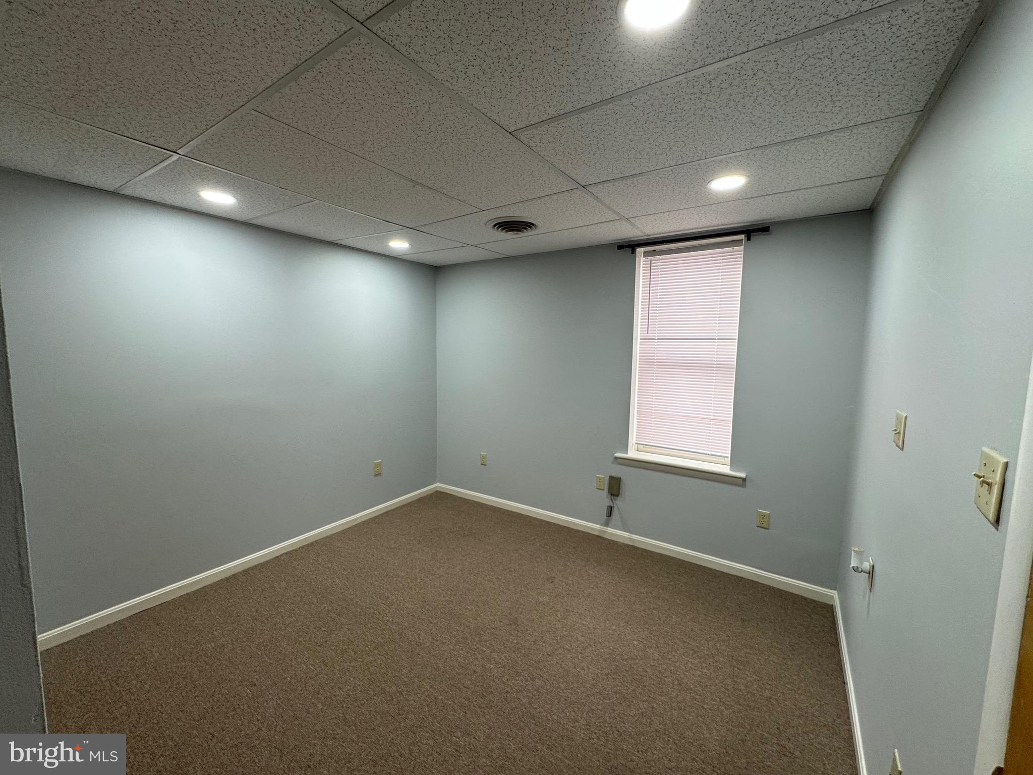 203 West John Street, Unit 4 Martinsburg, WV 25401 - Photo 7 of 17 an empty room with a window