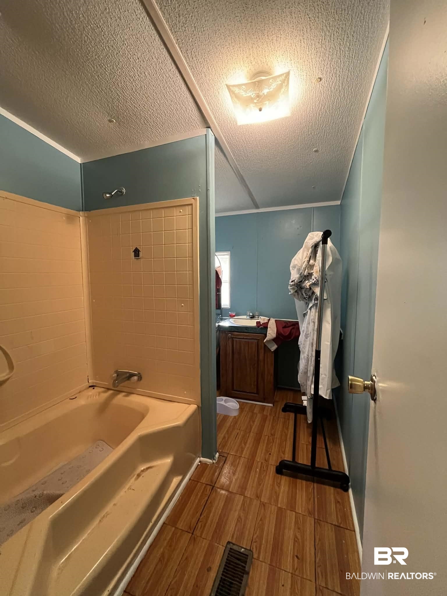 9628 Bryant's Lndg Road Stockton, AL 36579 - Photo 7 of 7 Full bath featuring bathing tub / shower combination and a textured ceiling