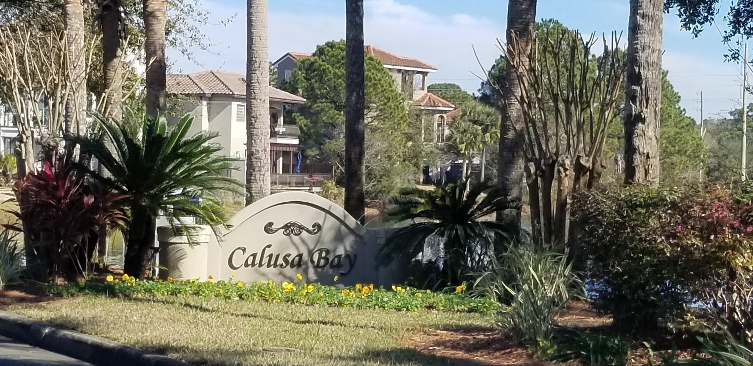 270 Calusa Boulevard Destin, FL 32541 - Photo 11 of 27 a sign that is on the side of the road