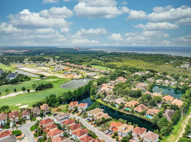 an aerial view of a house with a lake view