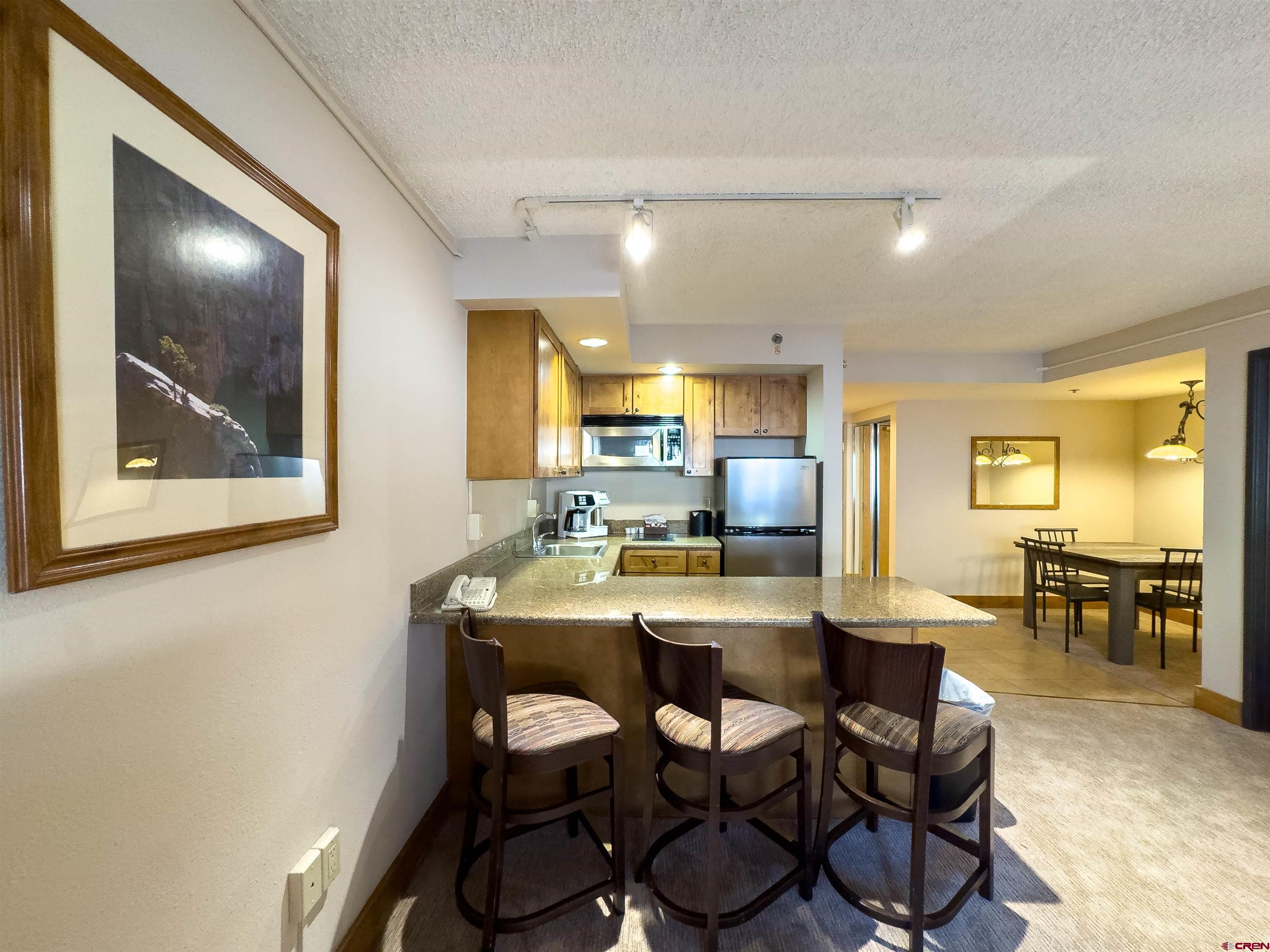 6 Emmons Road, Unit 125 Crested Butte, CO 81225 - Photo 11 of 42 a dining room with furniture and window