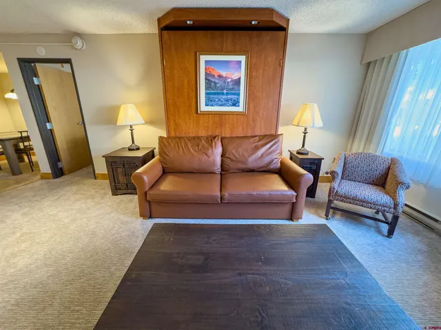a living room with furniture and a window