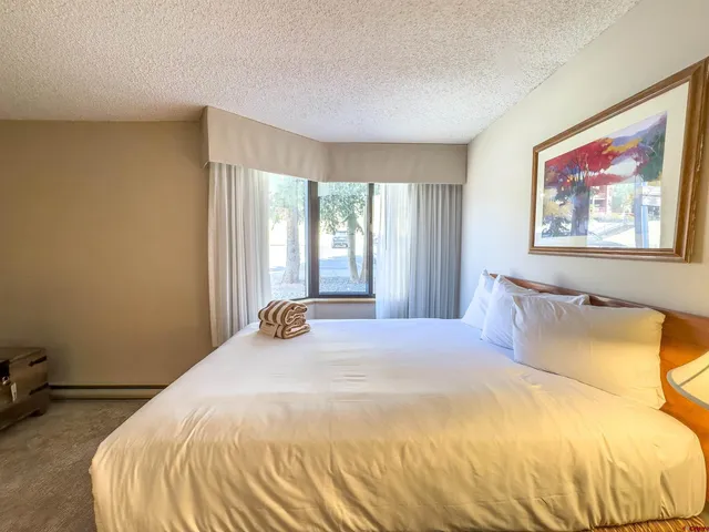 a hallway with a door and a couch