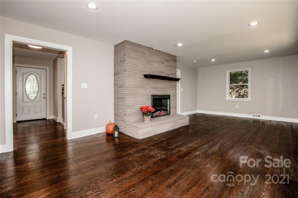 3748 Woodleaf Road Salisbury, NC 28147 - Photo 18 of 31 a living room with furniture and a wooden floor