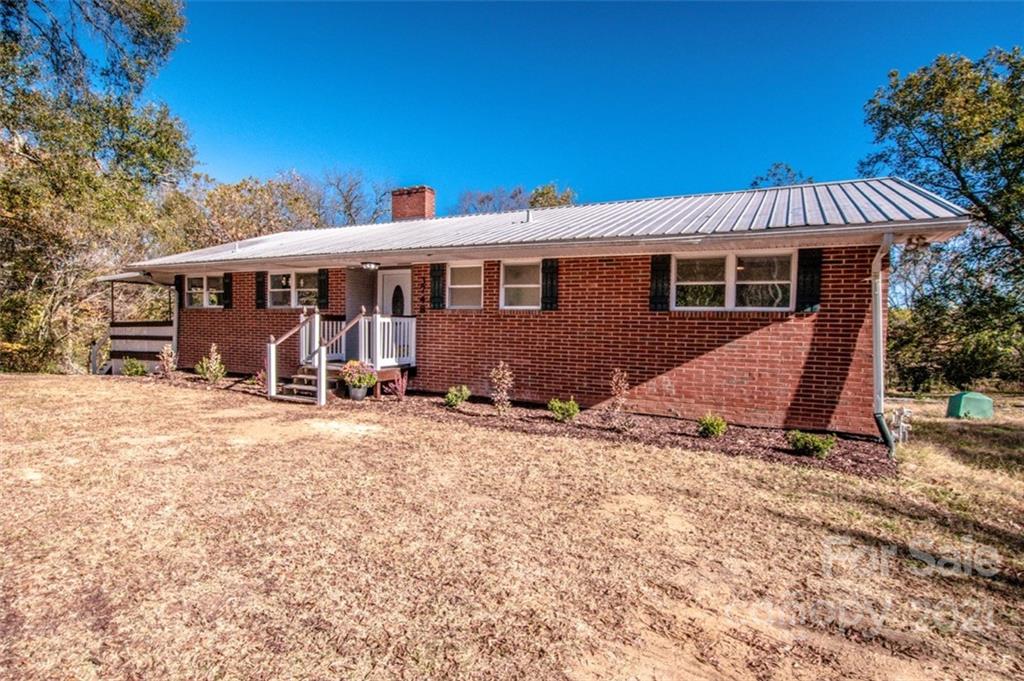 3748 Woodleaf Road Salisbury, NC 28147 - Photo 2 of 31 a view of a house with a yard and sitting area