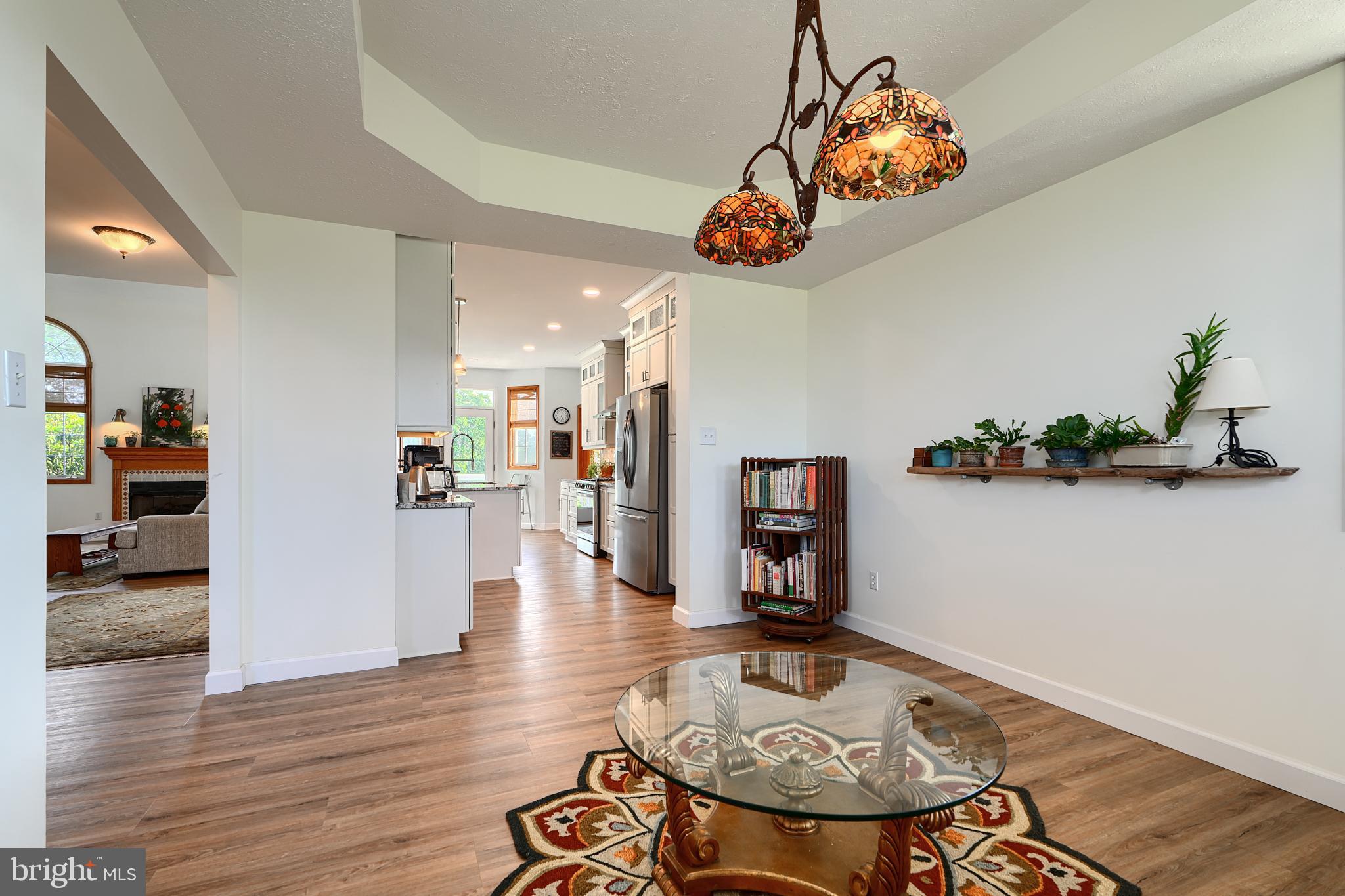 522 Little New York Road Rising Sun, MD 21911 - Photo 11 of 72 a view of a dining room and livingroom with furniture wooden floor a chandelier