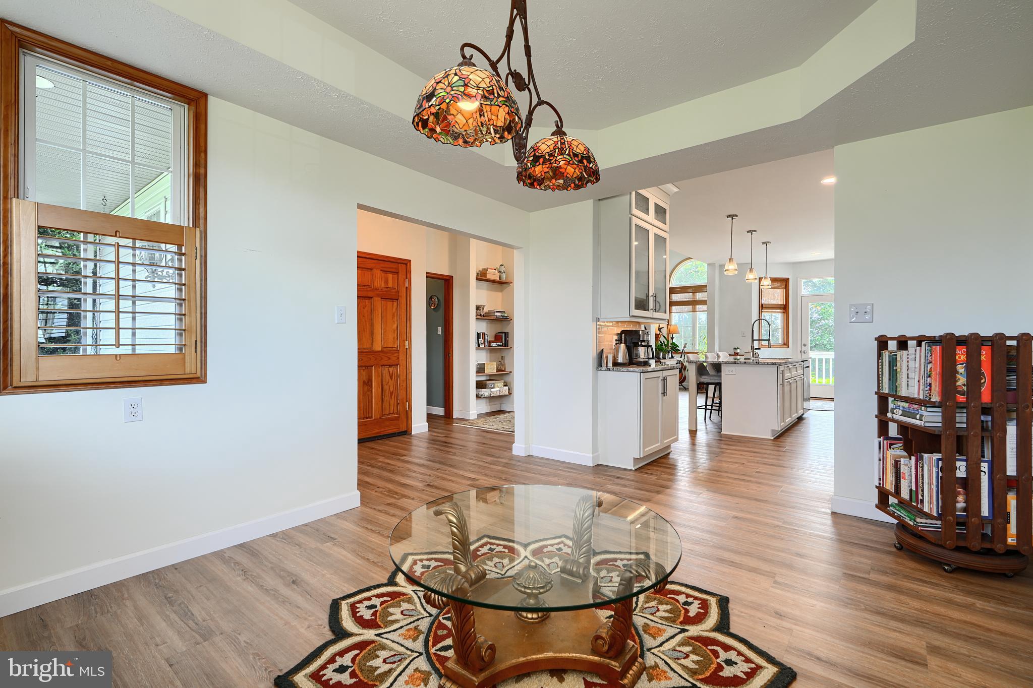 522 Little New York Road Rising Sun, MD 21911 - Photo 12 of 72 a view of a dining room and livingroom with furniture wooden floor a chandelier