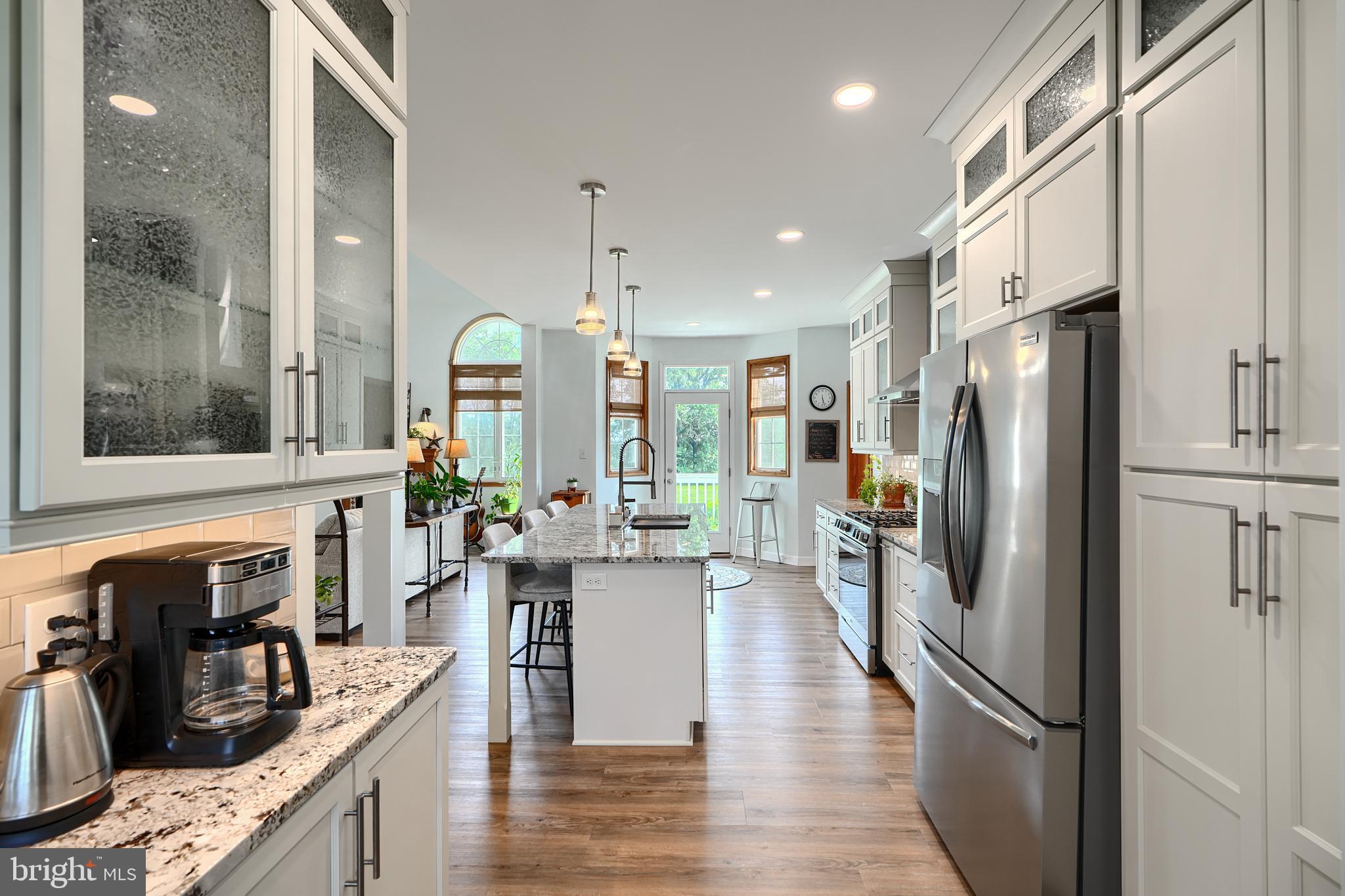 522 Little New York Road Rising Sun, MD 21911 - Photo 14 of 72 a kitchen with stainless steel appliances granite countertop a refrigerator a stove and a wooden floors