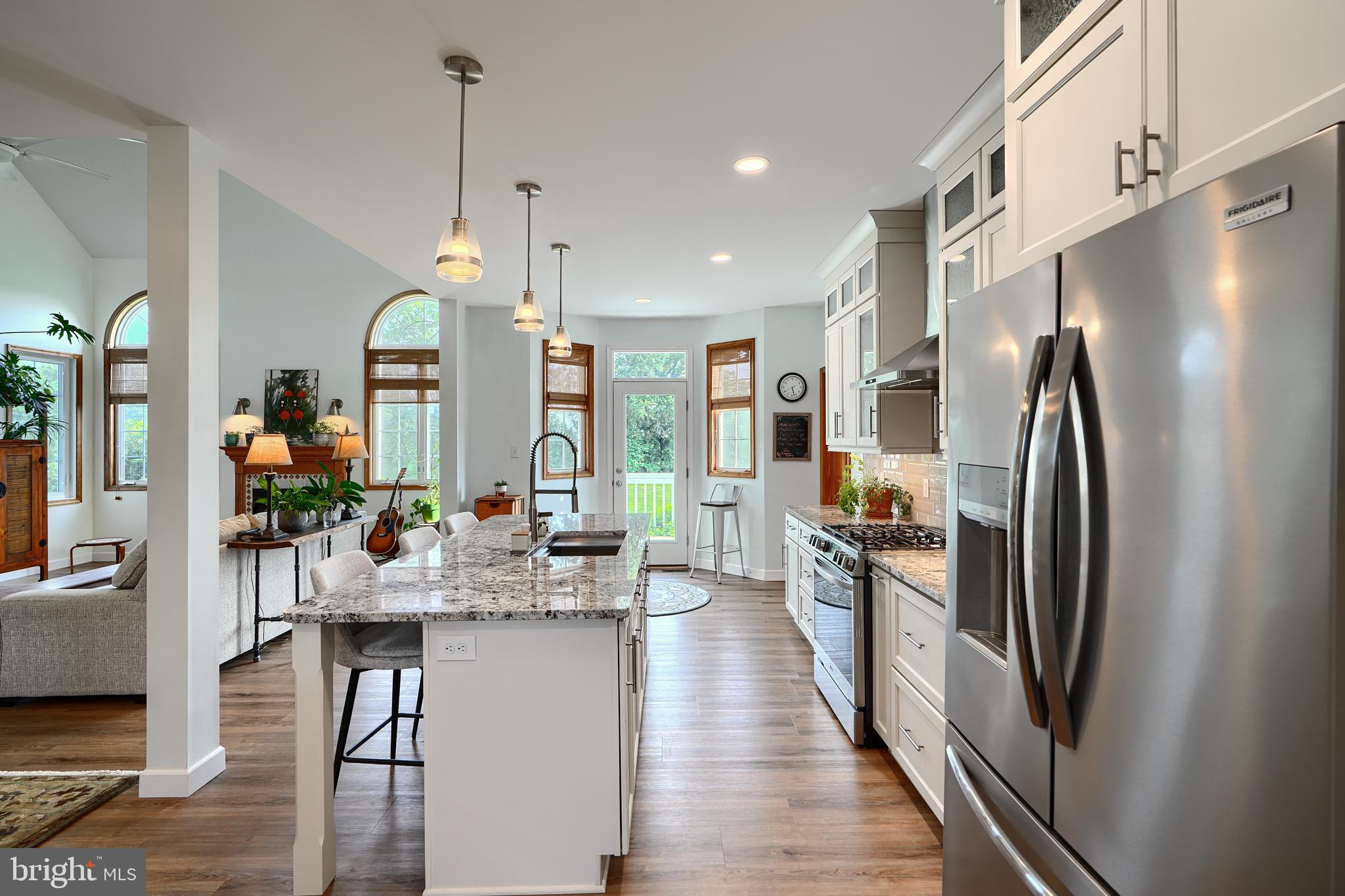 522 Little New York Road Rising Sun, MD 21911 - Photo 17 of 72 a kitchen with stainless steel appliances granite countertop a refrigerator a sink dishwasher a oven and a dining table with wooden floor
