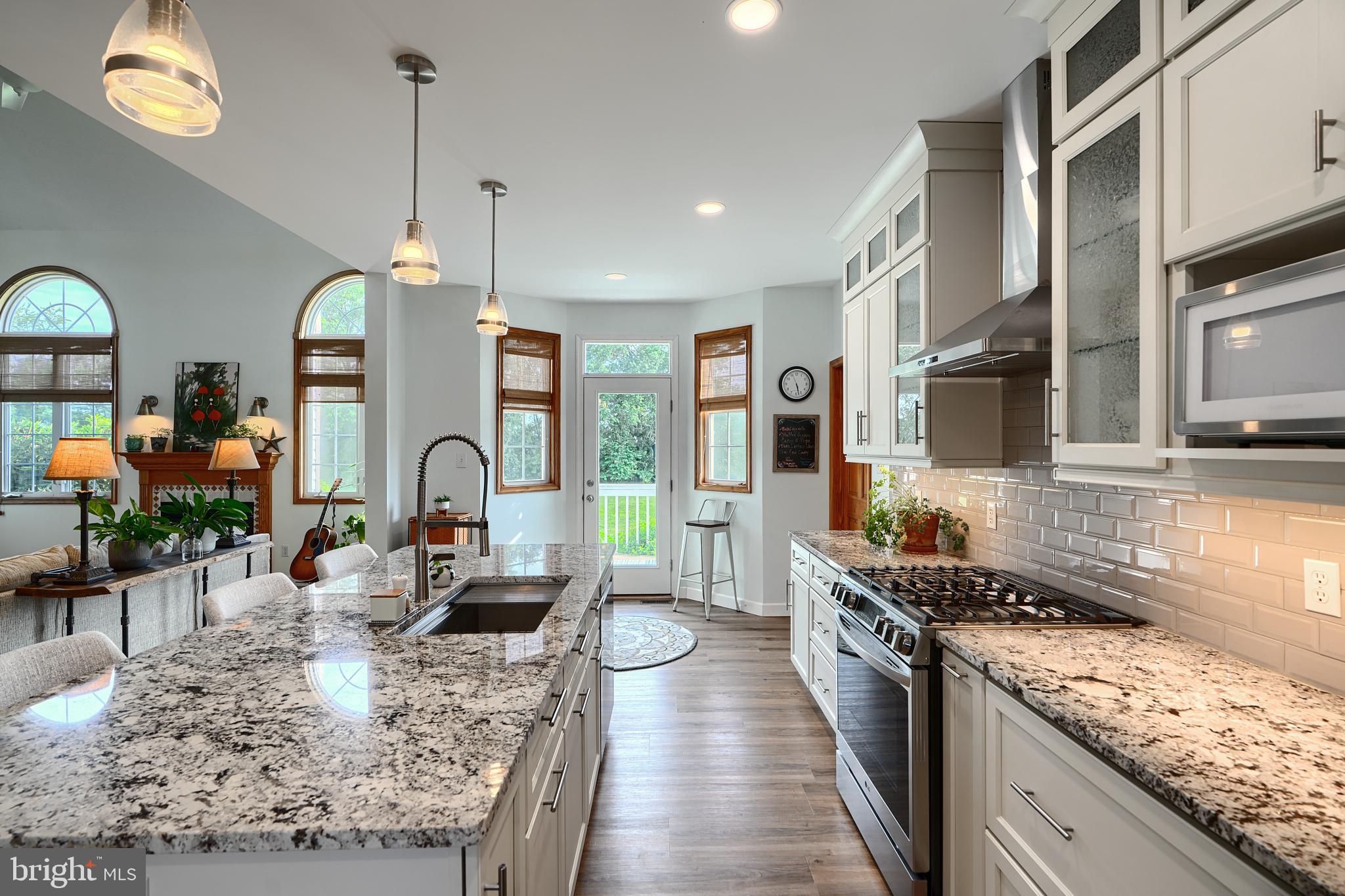 522 Little New York Road Rising Sun, MD 21911 - Photo 18 of 72 a large kitchen with stainless steel appliances granite countertop a stove and a sink