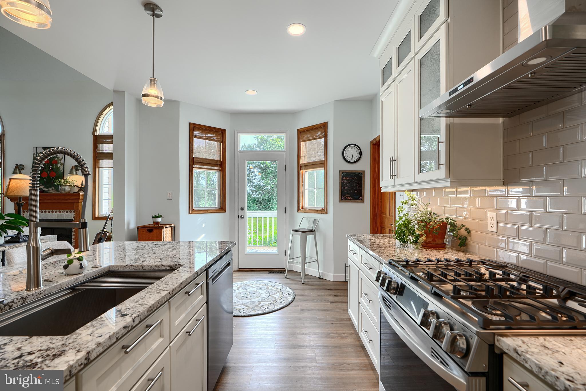 522 Little New York Road Rising Sun, MD 21911 - Photo 19 of 72 a kitchen with a stove a sink and a wooden cabinets