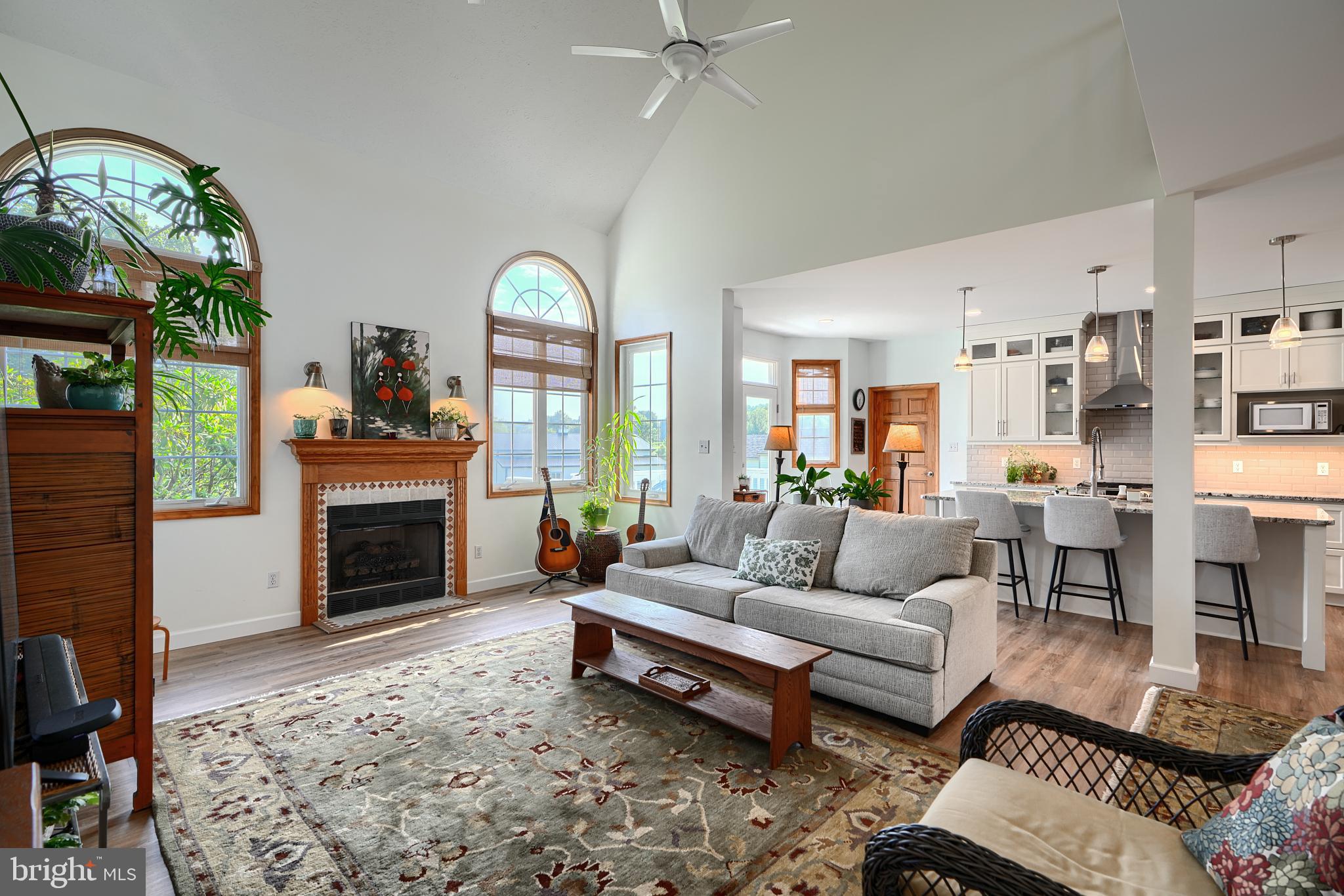 522 Little New York Road Rising Sun, MD 21911 - Photo 23 of 72 a living room with furniture a fireplace and a floor to ceiling window