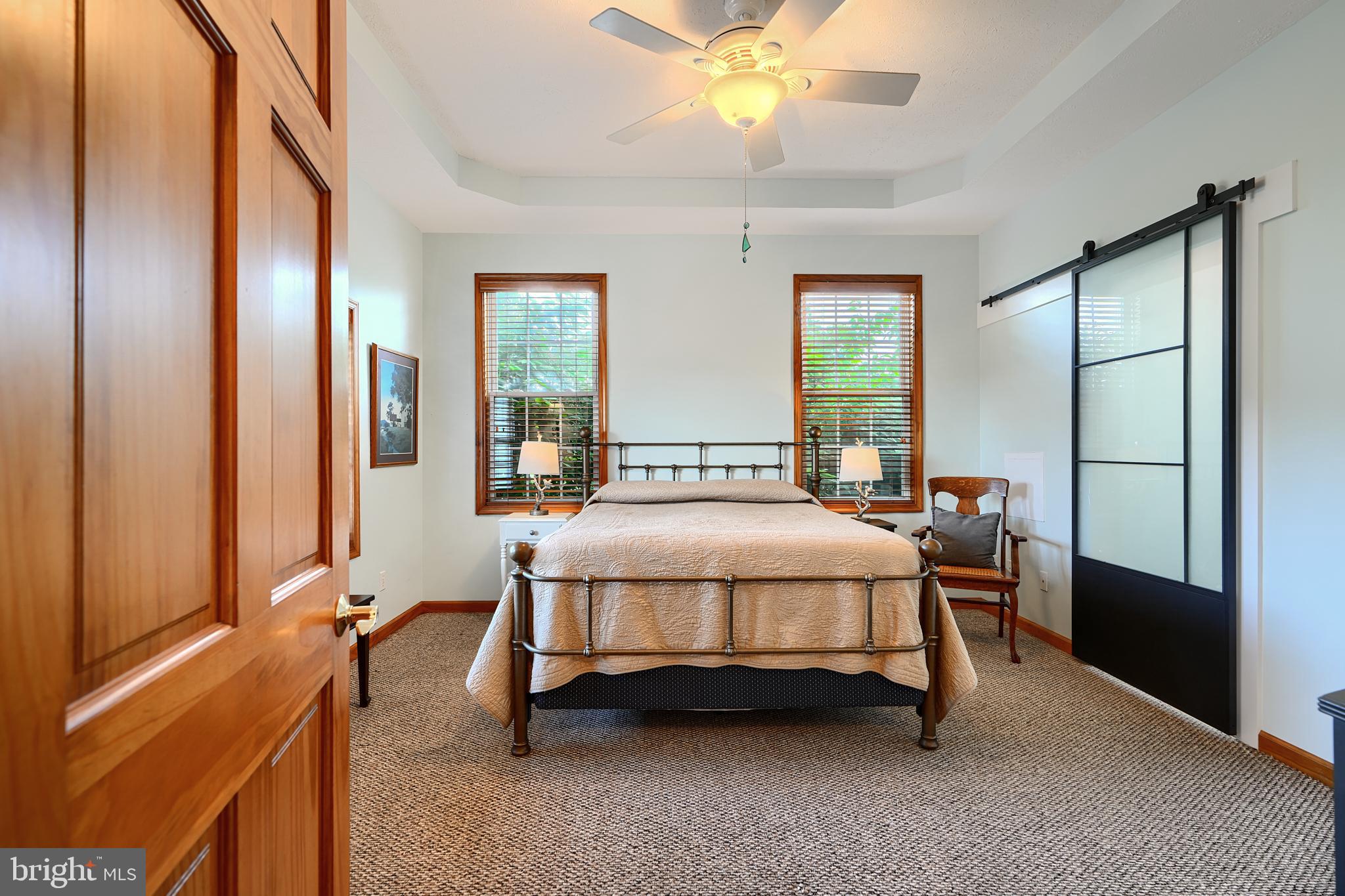 522 Little New York Road Rising Sun, MD 21911 - Photo 33 of 72 a bedroom with a bed and a chandelier