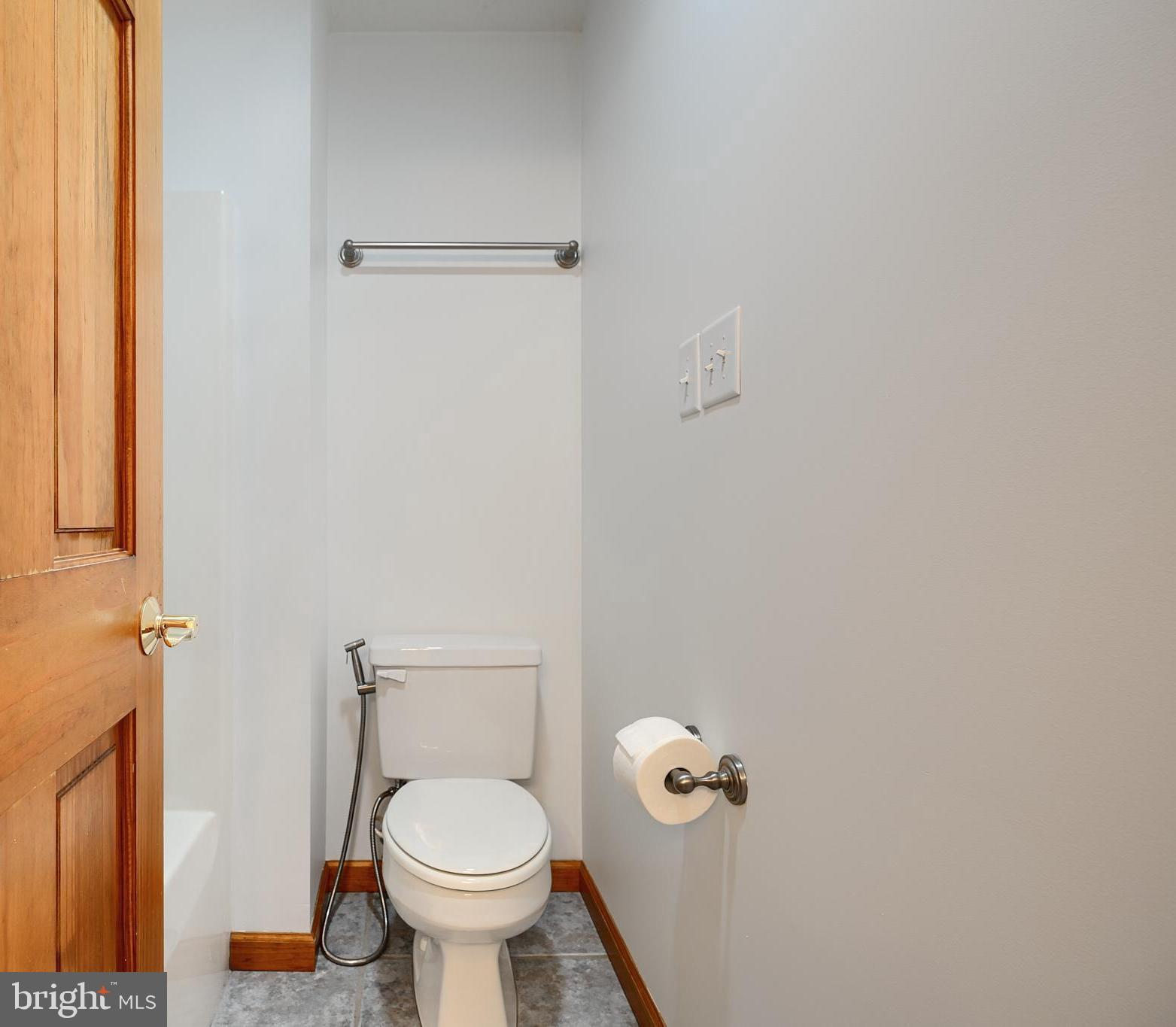 522 Little New York Road Rising Sun, MD 21911 - Photo 55 of 72 a white toilet sitting in a bathroom next to a sink