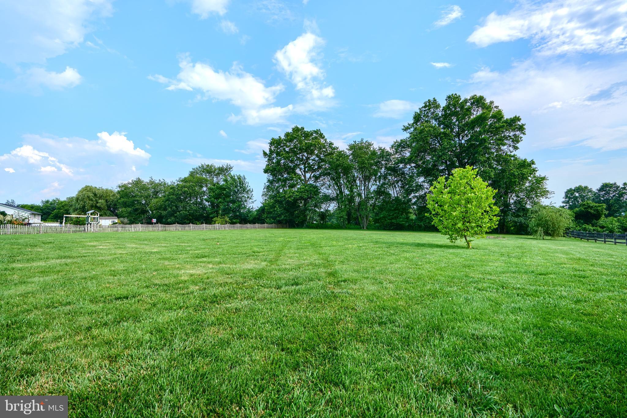 522 Little New York Road Rising Sun, MD 21911 - Photo 65 of 72 a view of a green field with wooden fence