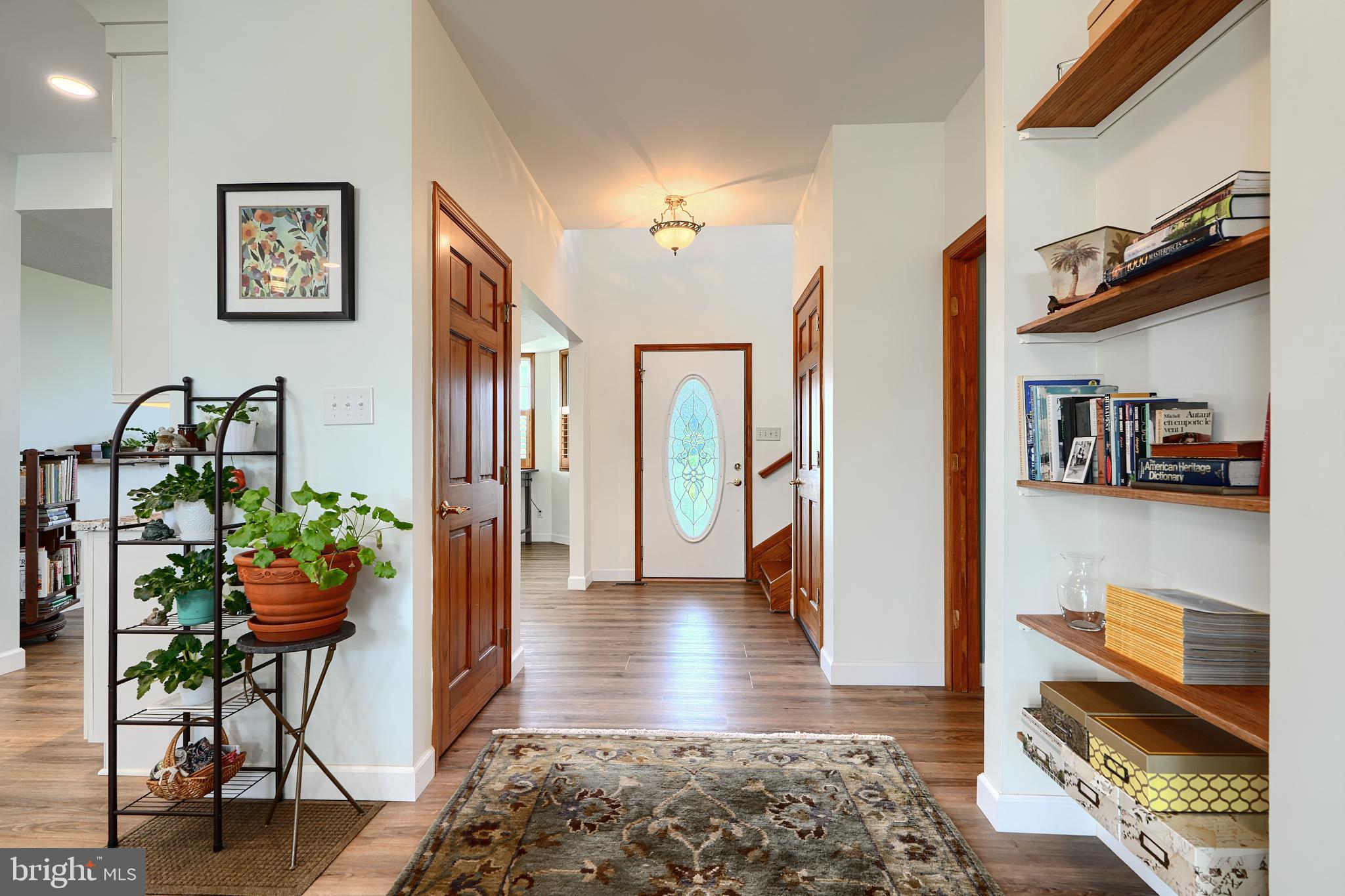 522 Little New York Road Rising Sun, MD 21911 - Photo 7 of 72 a hallway with a dining table and chairs