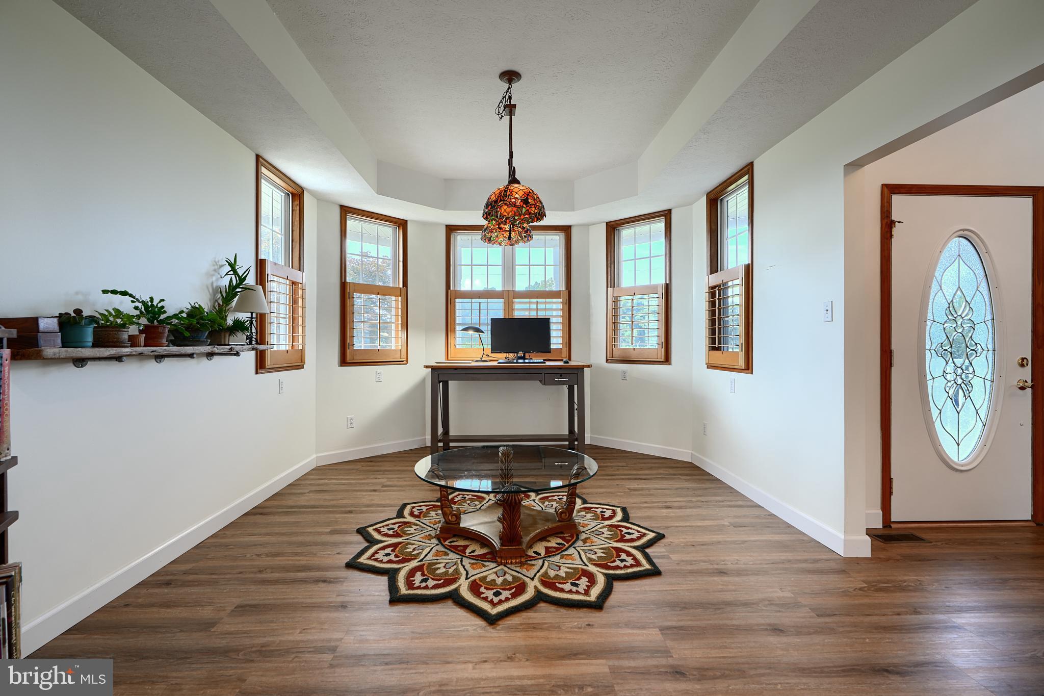 522 Little New York Road Rising Sun, MD 21911 - Photo 9 of 72 a living room with furniture a window and wooden floor