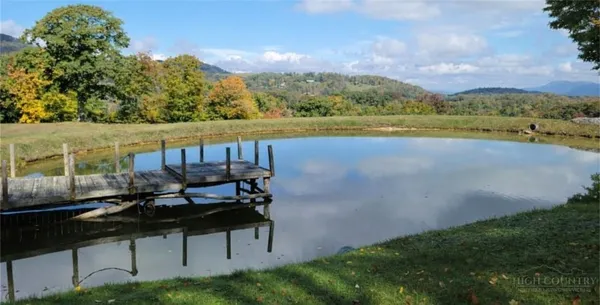 a view of a lake with a yard