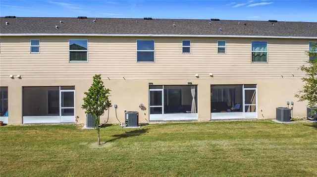 an aerial view of a house with outdoor space