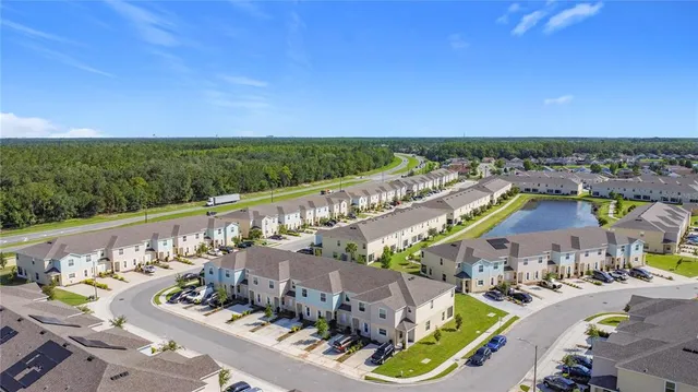 a view of a swimming pool with an outdoor seating