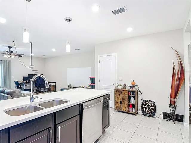 a kitchen with a sink and cabinets